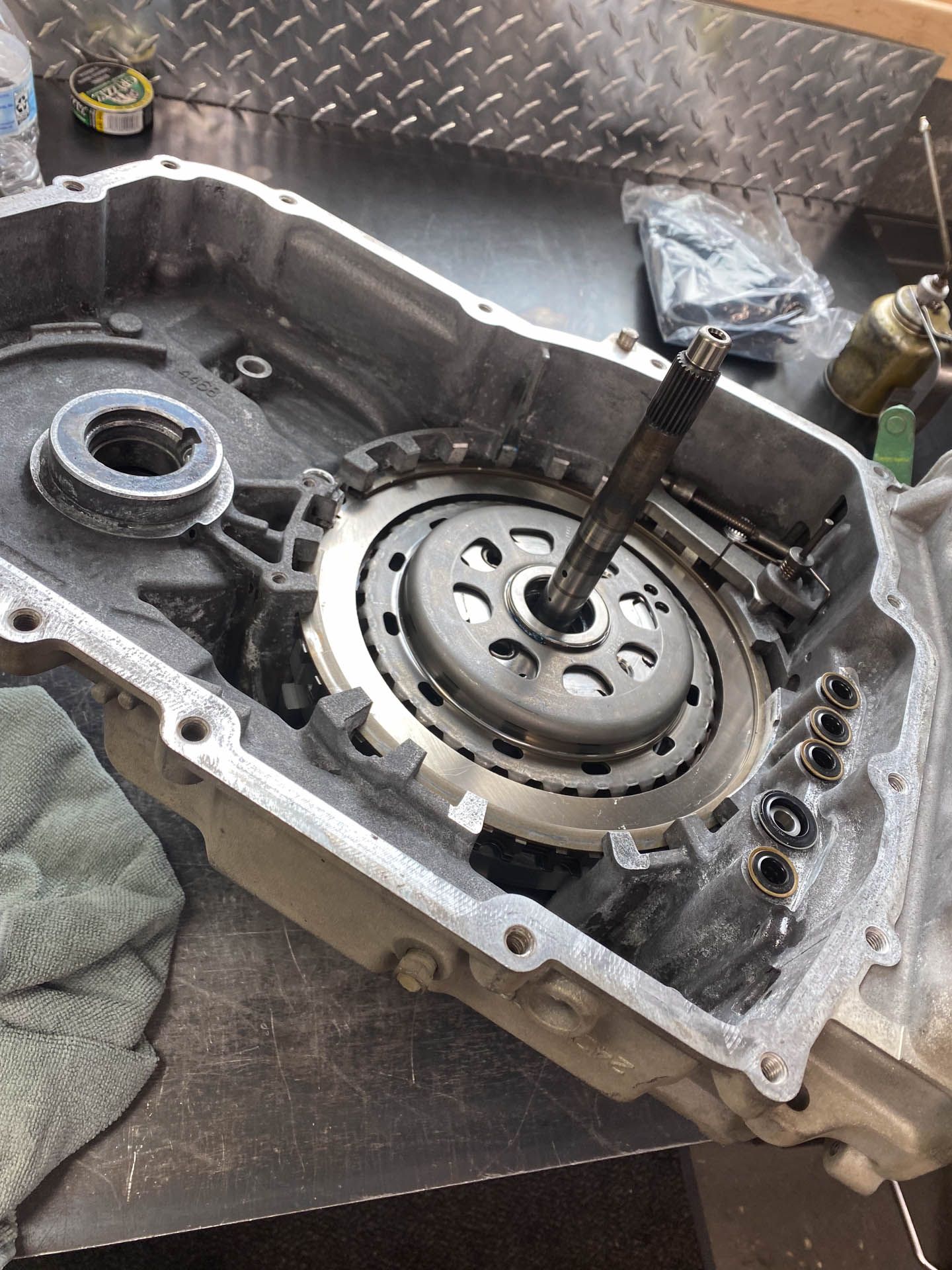 A close up of a clutch on a motorcycle engine.