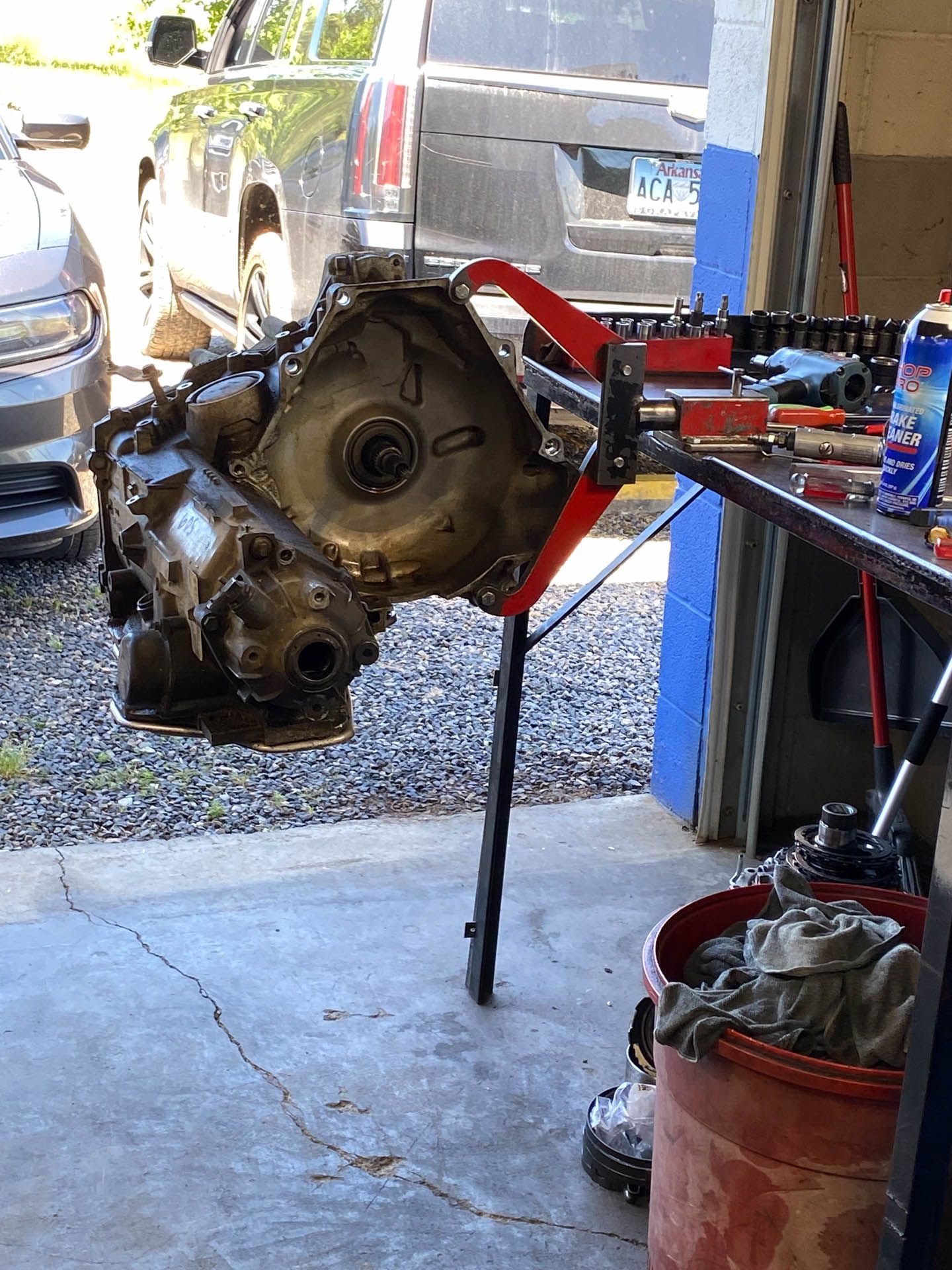 A car engine is being worked on in a garage.