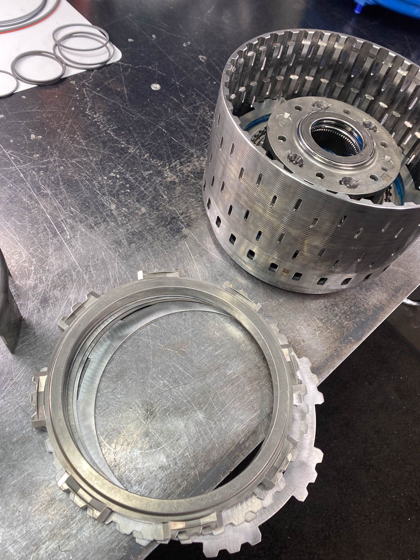 A metal object is sitting on top of a metal table.