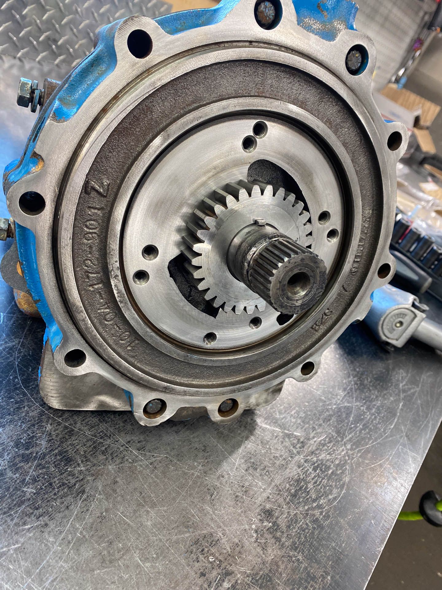 A close up of a gear on a machine on a table.
