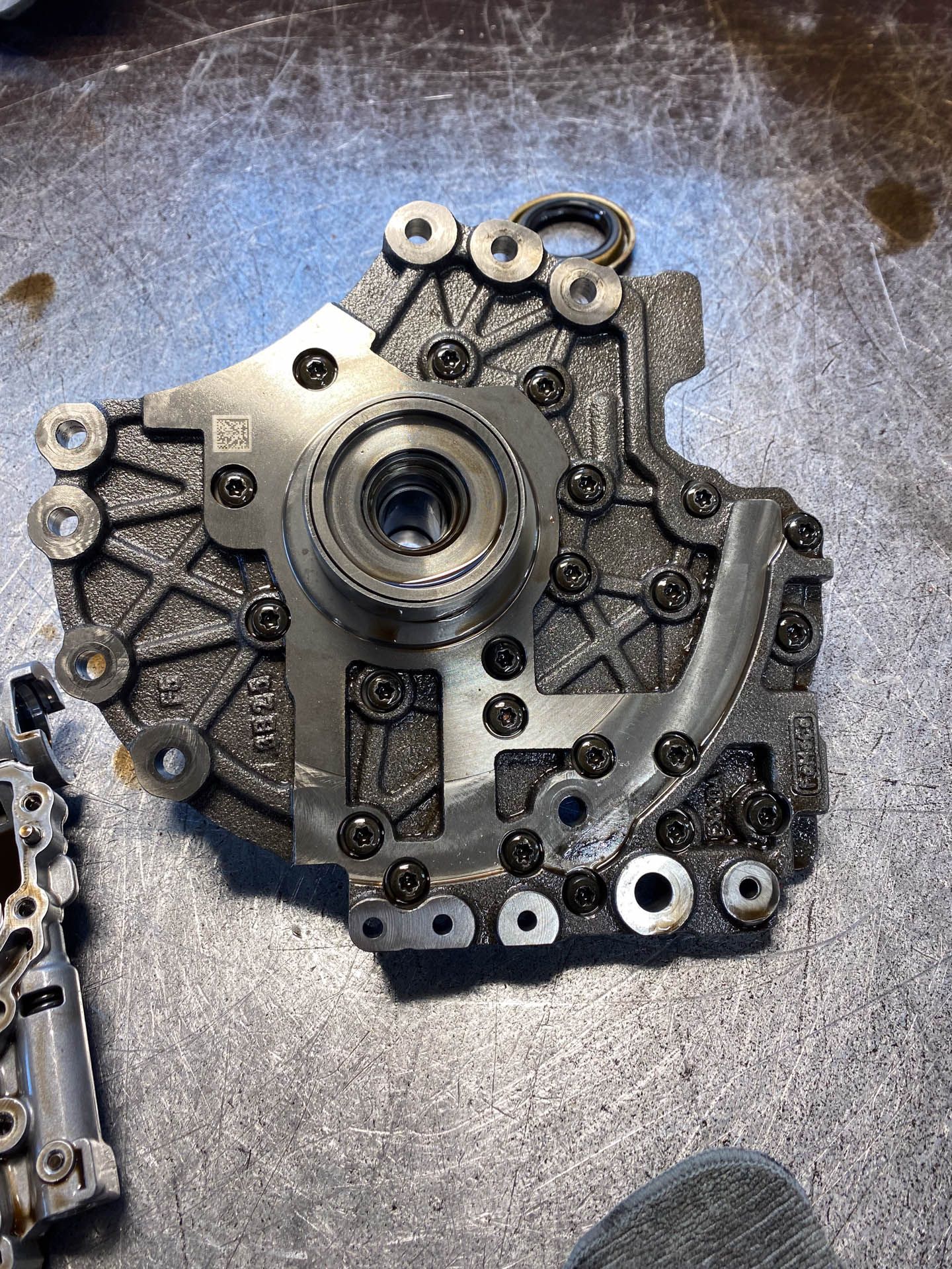 A piece of metal is sitting on top of a metal surface.