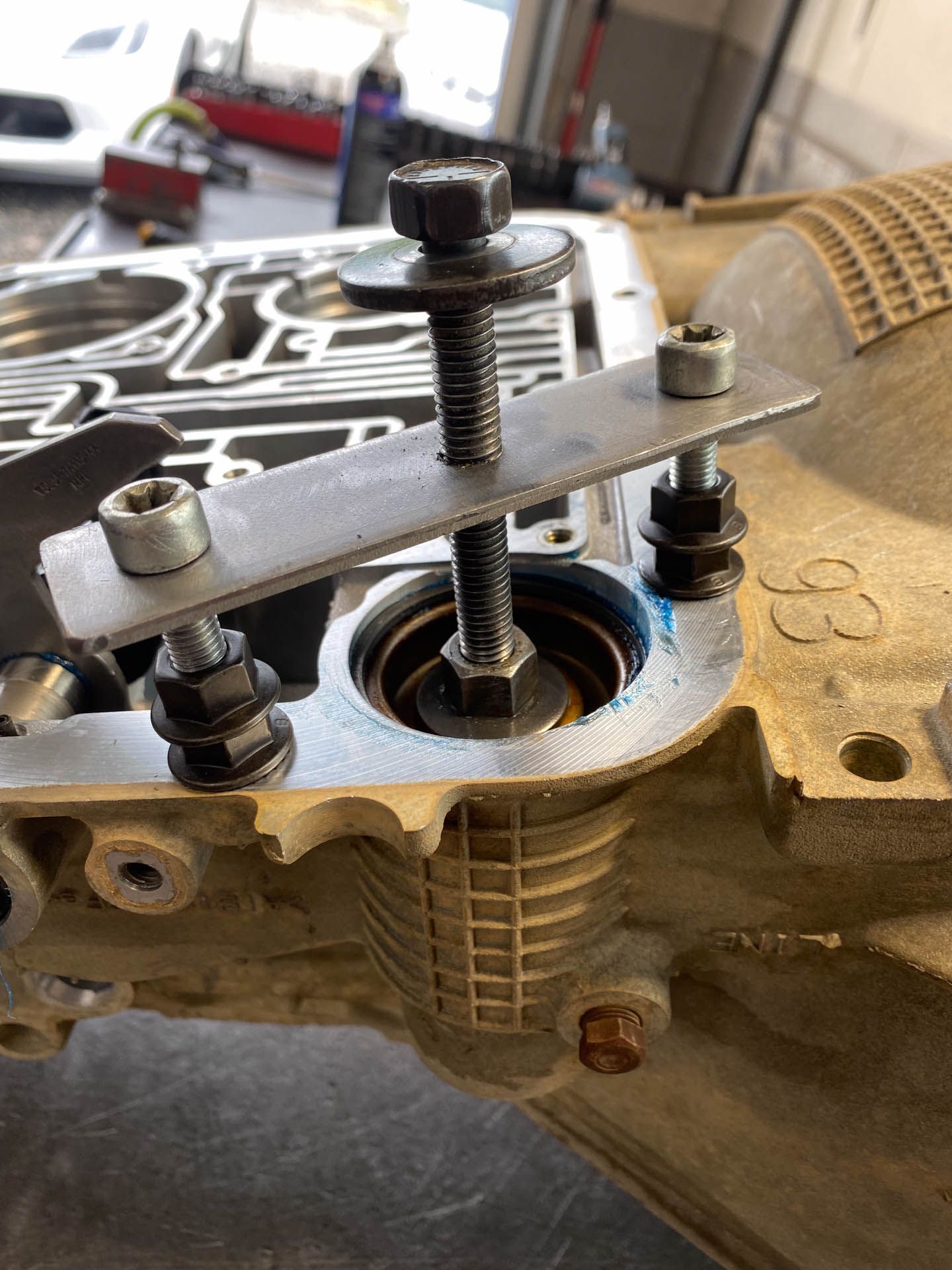 A close up of a metal object with a screw in it.