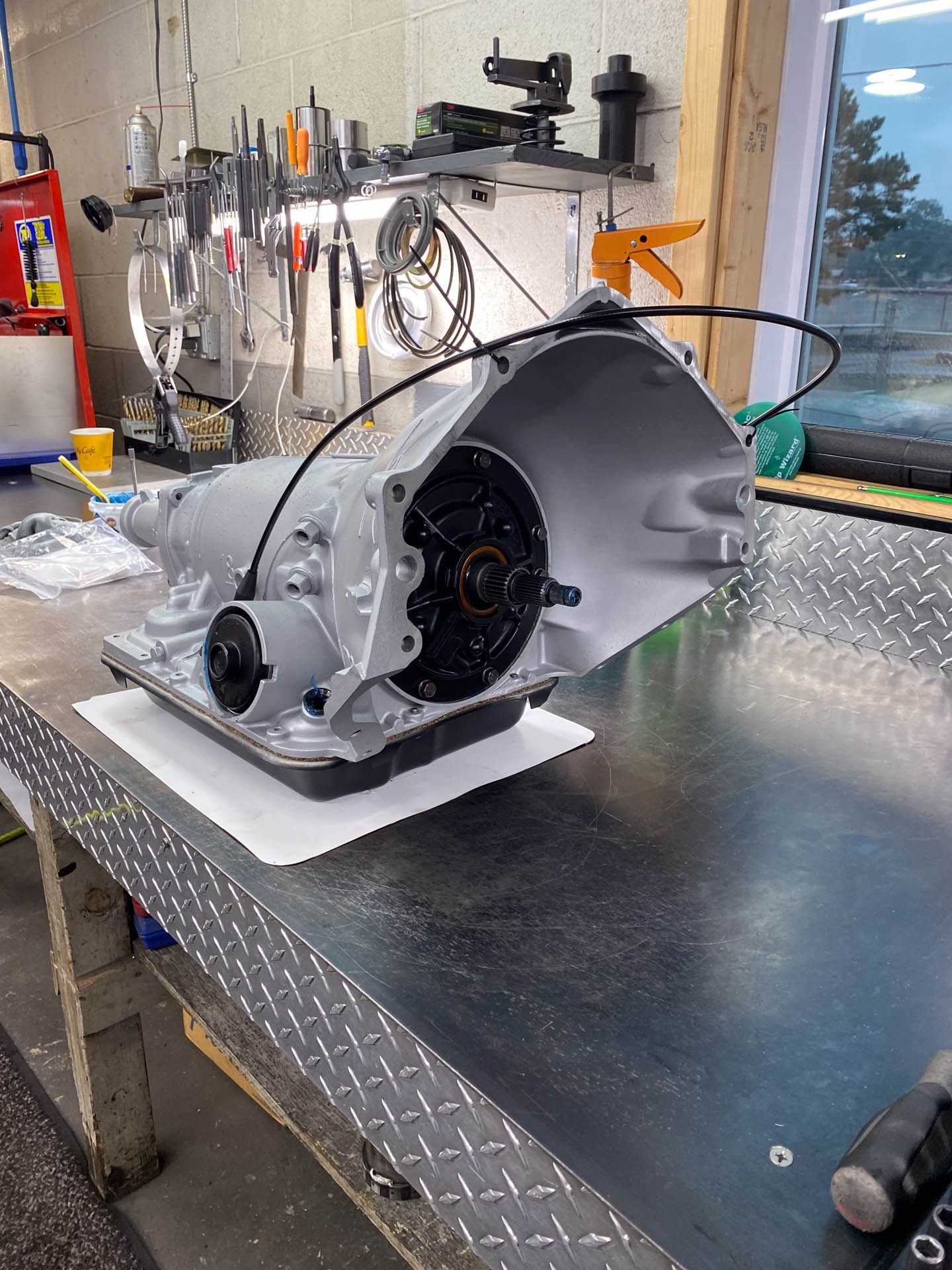 A gearbox is sitting on top of a metal table.