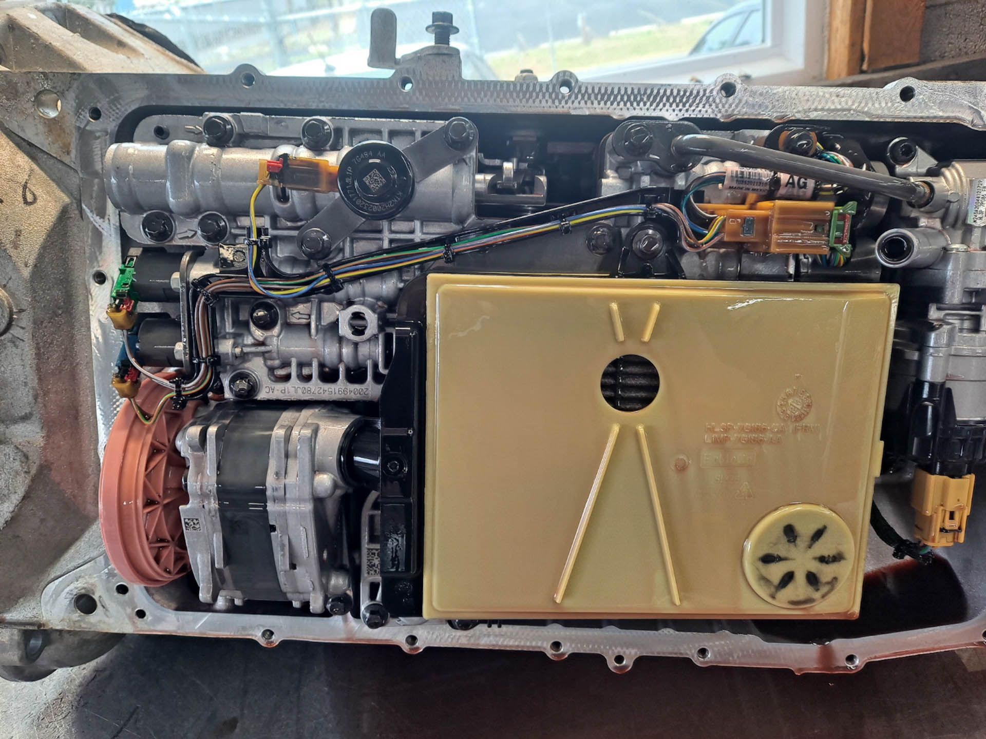 A close up of the inside of a car engine.