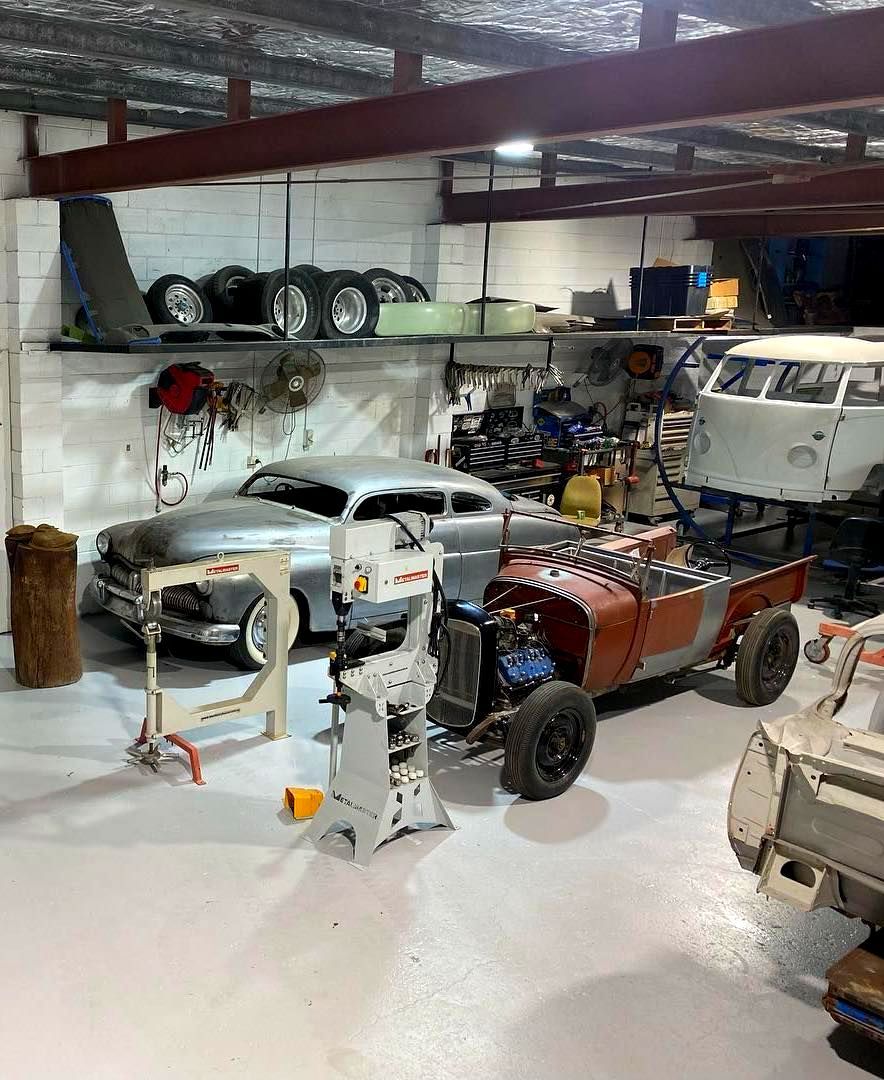 A Silver Car is Parked in a Garage Next to a Fan — Auto Craft Collective in Rockhampton, QLD