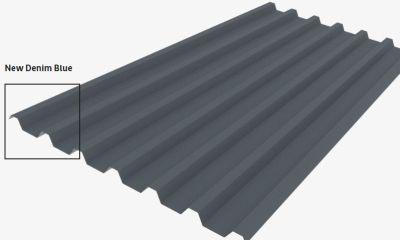 A gray corrugated metal roof with a new denim blue color.