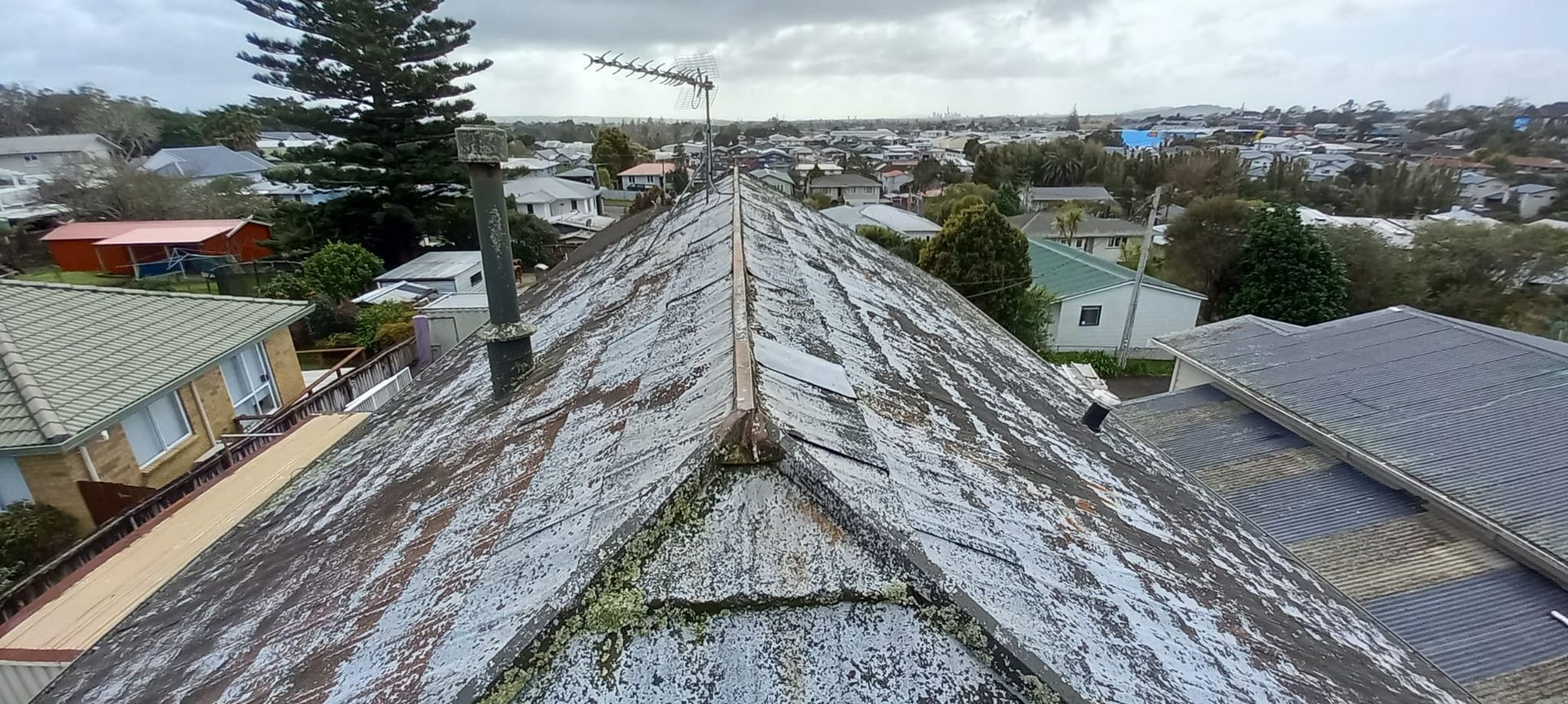 An aerial view of a roof with a lot of hail on it