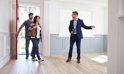Realtor Showing Couple Around New Home
