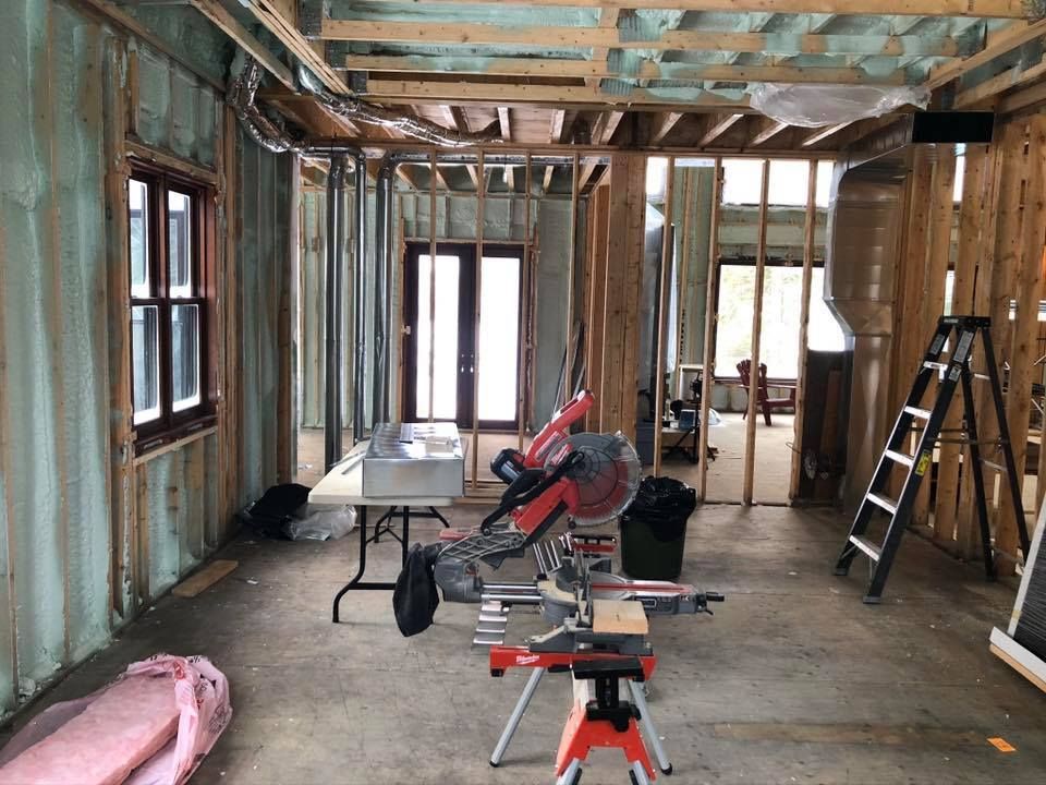 A room with a table and a saw in it.