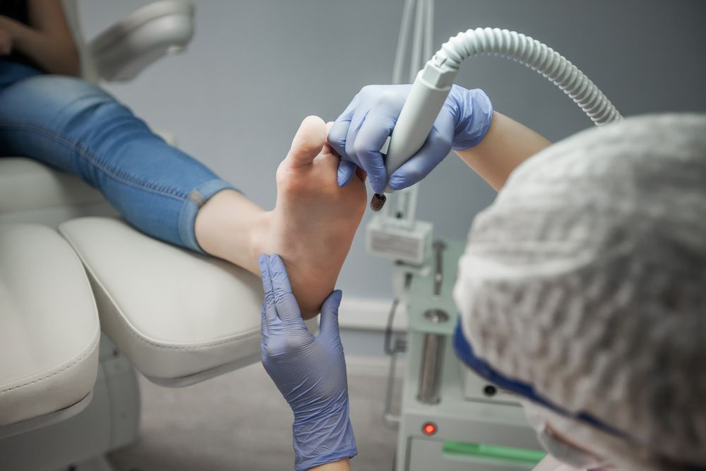 A Woman Is Getting A Foot Treatment At A Beauty Salon — Kingaroy Podiatry Foot Care Clinic in Kingaroy, QLD