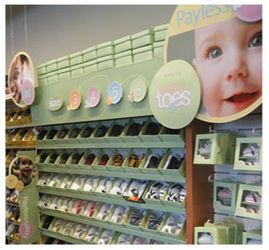 Photo that shows store display for Teeny Toes brand shoes