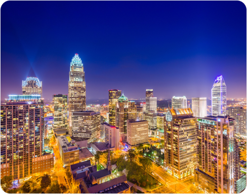 An aerial view of a city skyline at night.