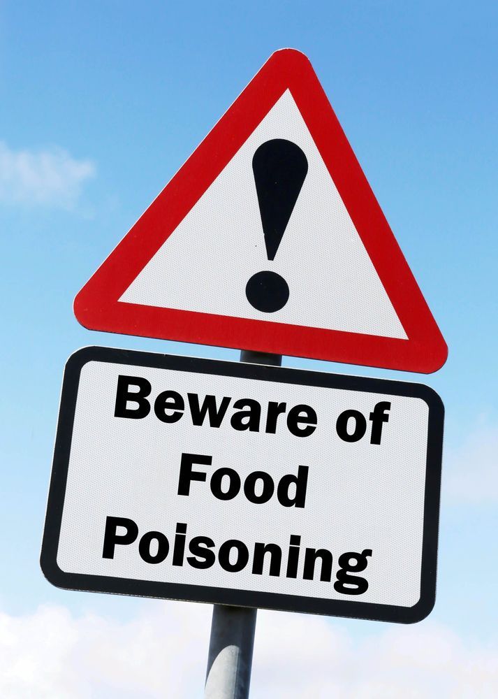 A beware of food poisoning sign with an exclamation point