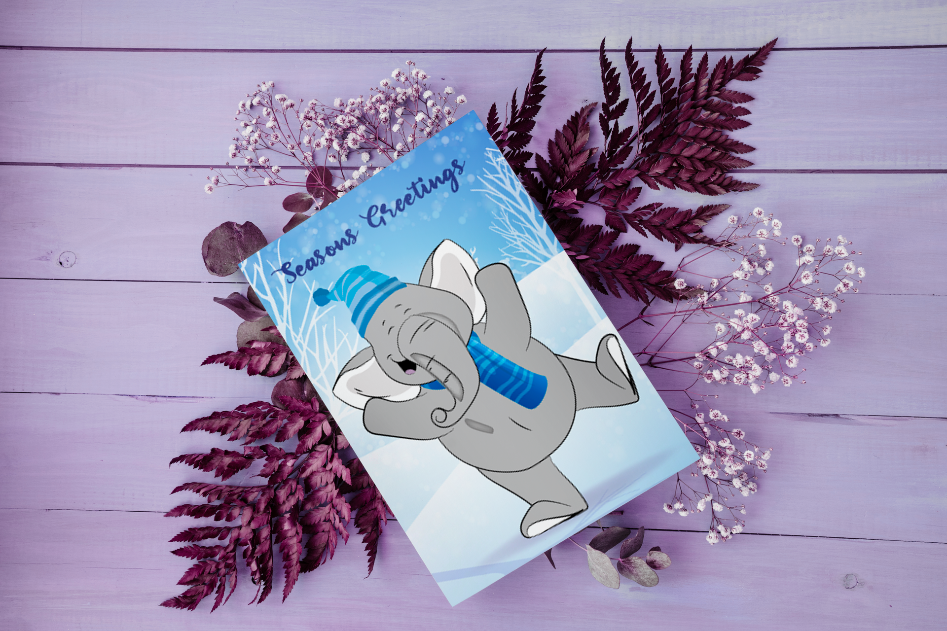 A greeting card with a picture of an elephant and the words