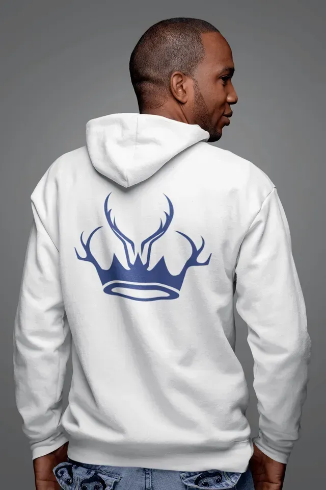 A man is wearing a white hoodie with a blue crown on the back.