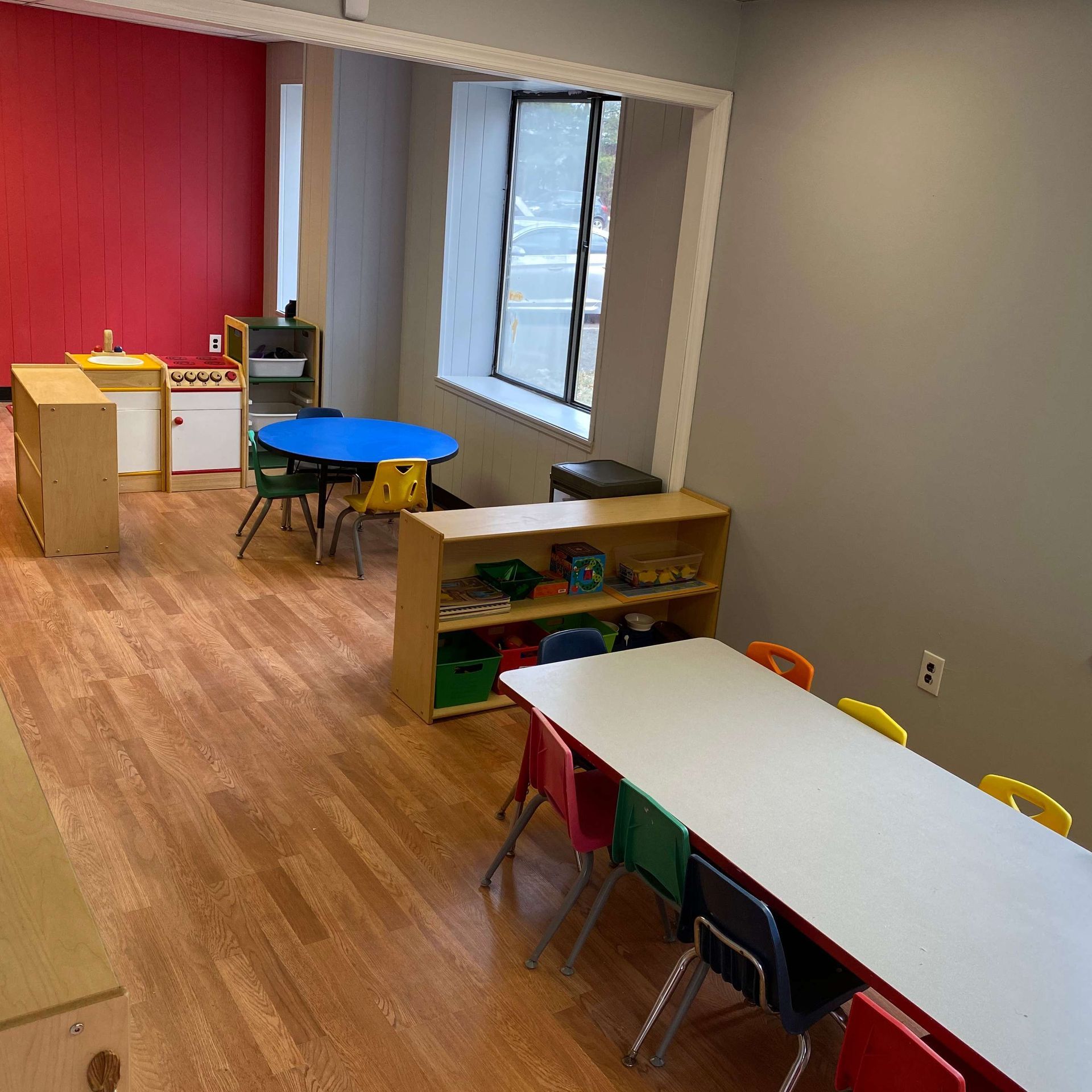 A room with a table and chairs in it