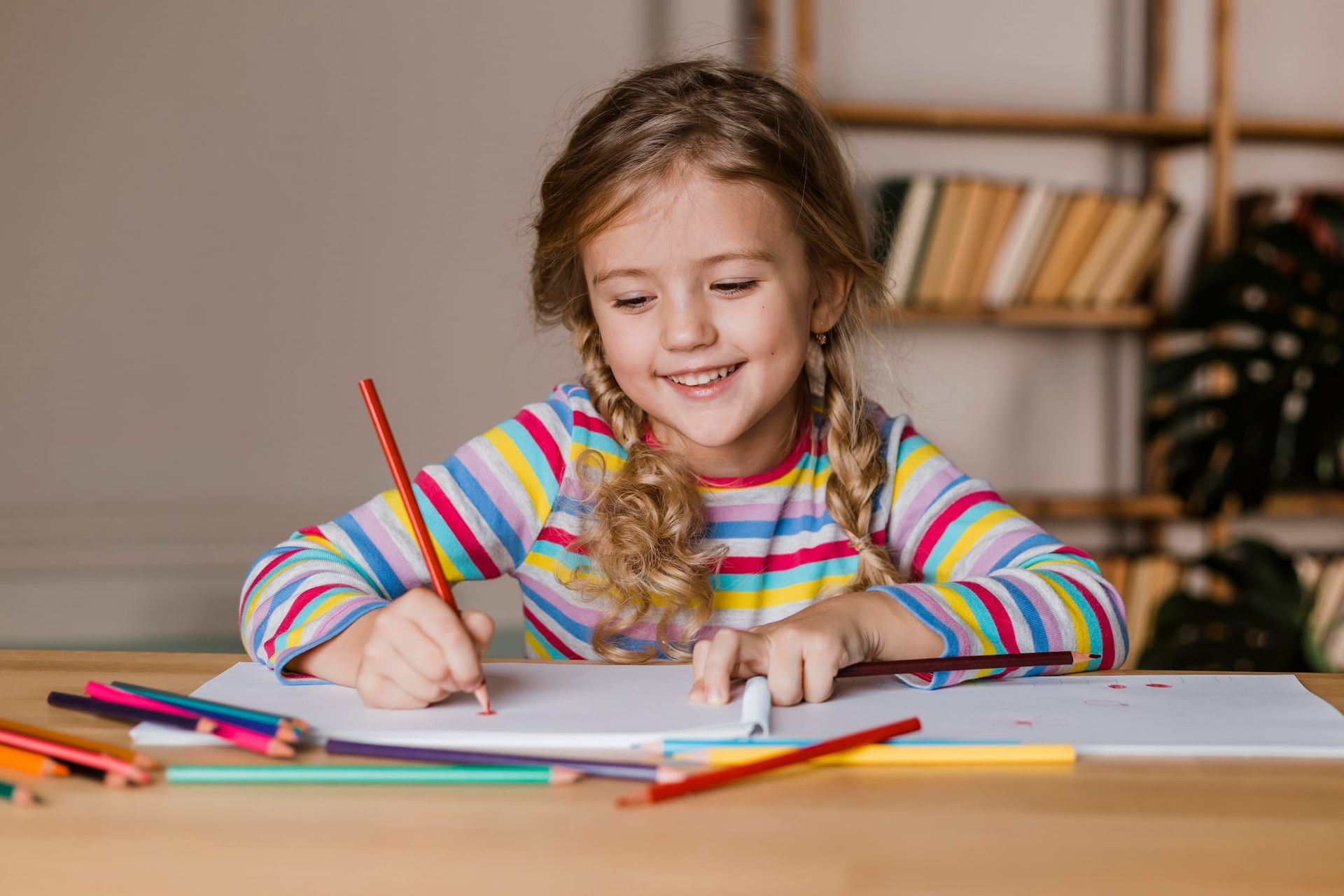 little-girl-with-autism-coloring-happily-during-aba-therapy