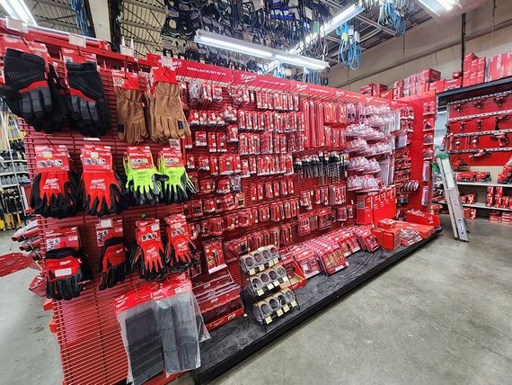 a store filled with lots of Milwaukee tools and gloves.