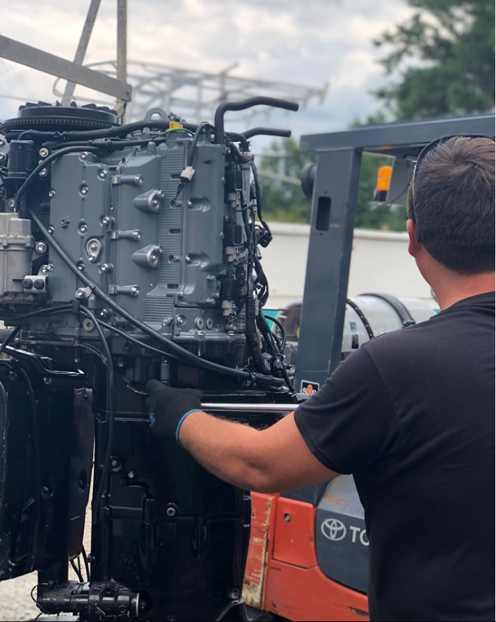 Man Fixing Boat Parts — Chesapeake, VA — Lancet Marine