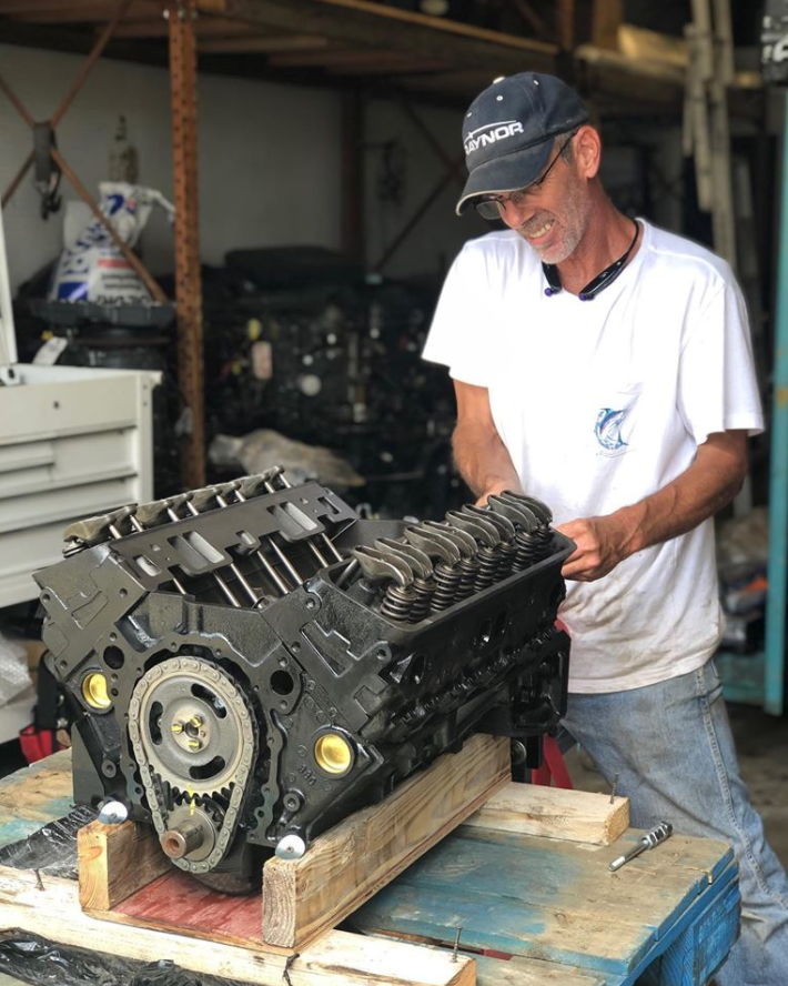 Man Repairing Boat Engine — Chesapeake, VA — Lancet Marine