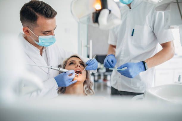 Dentist performing a procedure on a patient at Parkway Dental of Clinton, family dentistry in Byram,