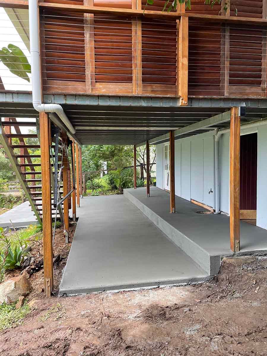 Concrete Walkway Leading to a House with a Wooden Deck — Providing Steel & Concrete Construction in Lismore, NSW