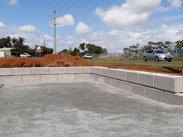 Car Is Parked On The Side Of The Road Next To A Pile Of Dirt — Providing Steel & Concrete Construction In Eviron, NSW