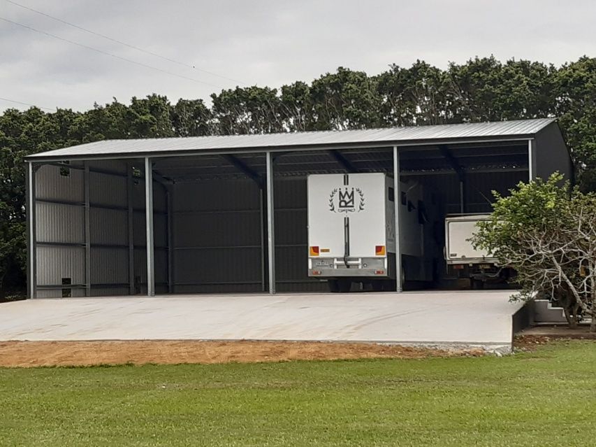 White Truck Parked In Front Of A Large Metal Building — Providing Steel & Concrete Construction In Eviron, NSW