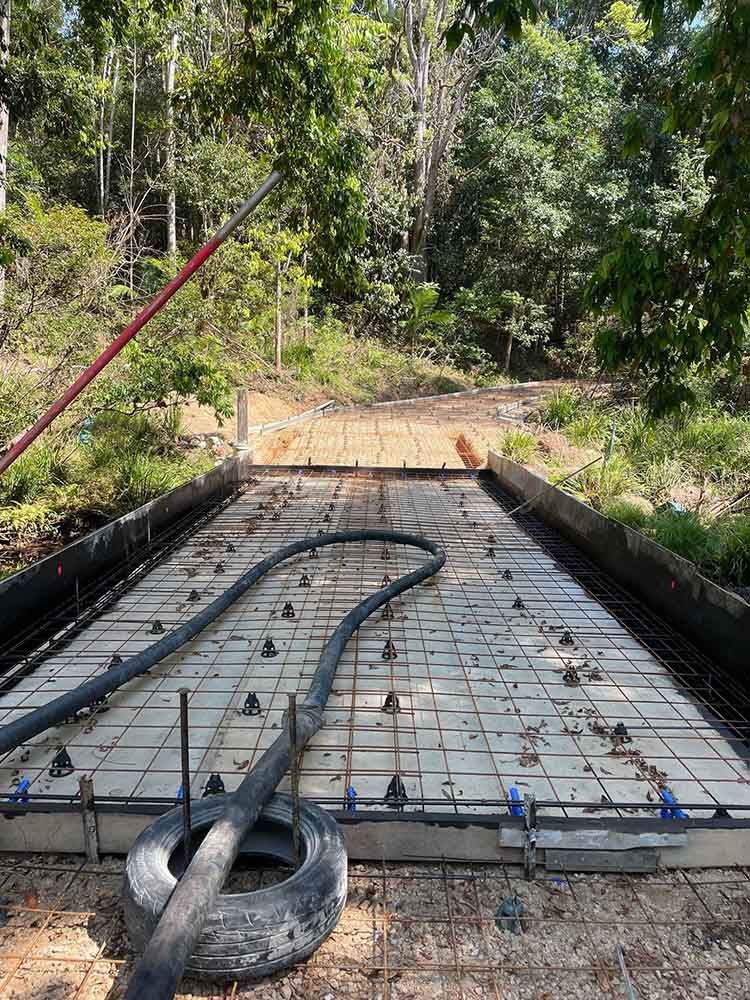 Tire Is Sitting On Top Of A Concrete Slab — Providing Steel & Concrete Construction In Eviron, NSW