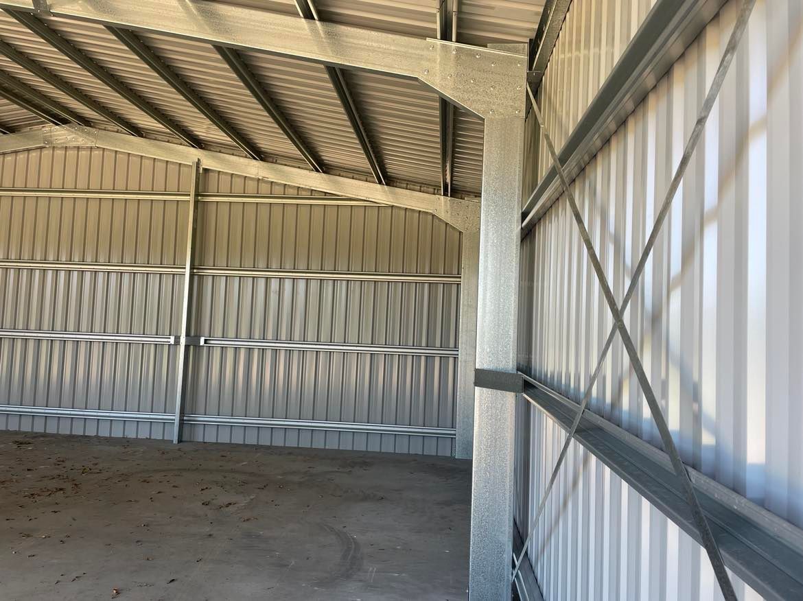 Inside Of A Metal Building With A Roof And Walls — Providing Steel & Concrete Construction In Eviron, NSW