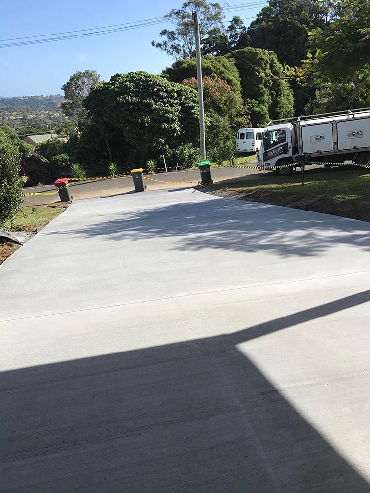 Truck Is Parked On The Side Of A Concrete Driveway — Providing Steel & Concrete Construction In Lismore, NSW