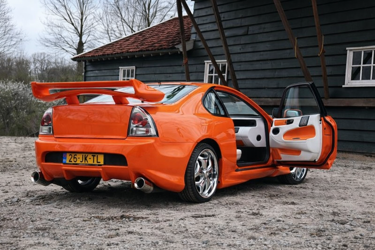 Zeilmakerij Road&River zeilmakerij stoffeerderij honda Prelude oranje 