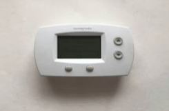 White Honeywell Basic Thermostat — Beaver Falls, PA — Johnson’s Heating & Cooling, LLC