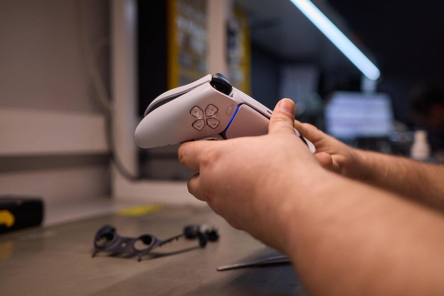 Person using a calculator with a pen, working on documents.