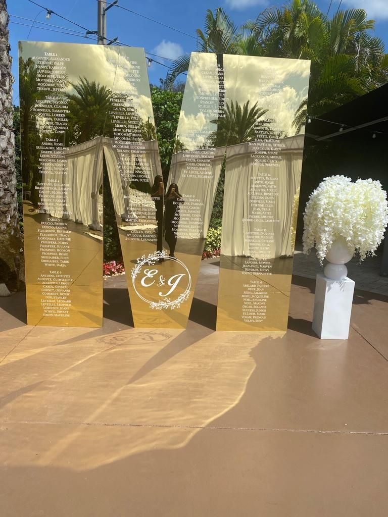a couple of large gold letters sitting on top of a table .