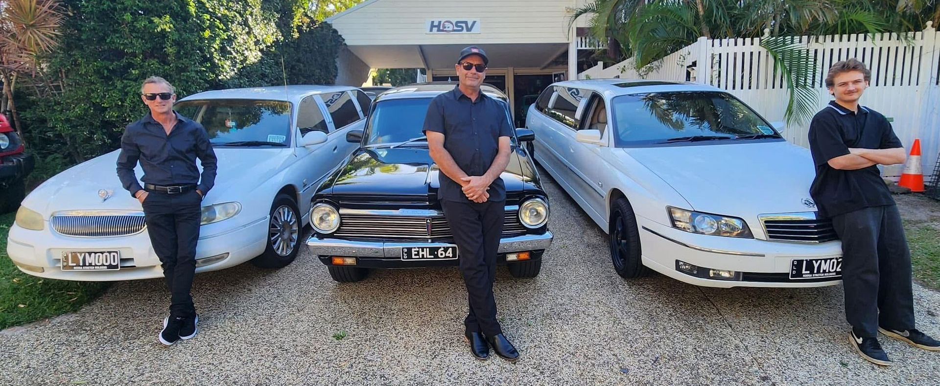 Worker Standing In Front Of Cars Smiling - Noosa Premier Stretch Holden Transfers In Sunrise Beach, QLD