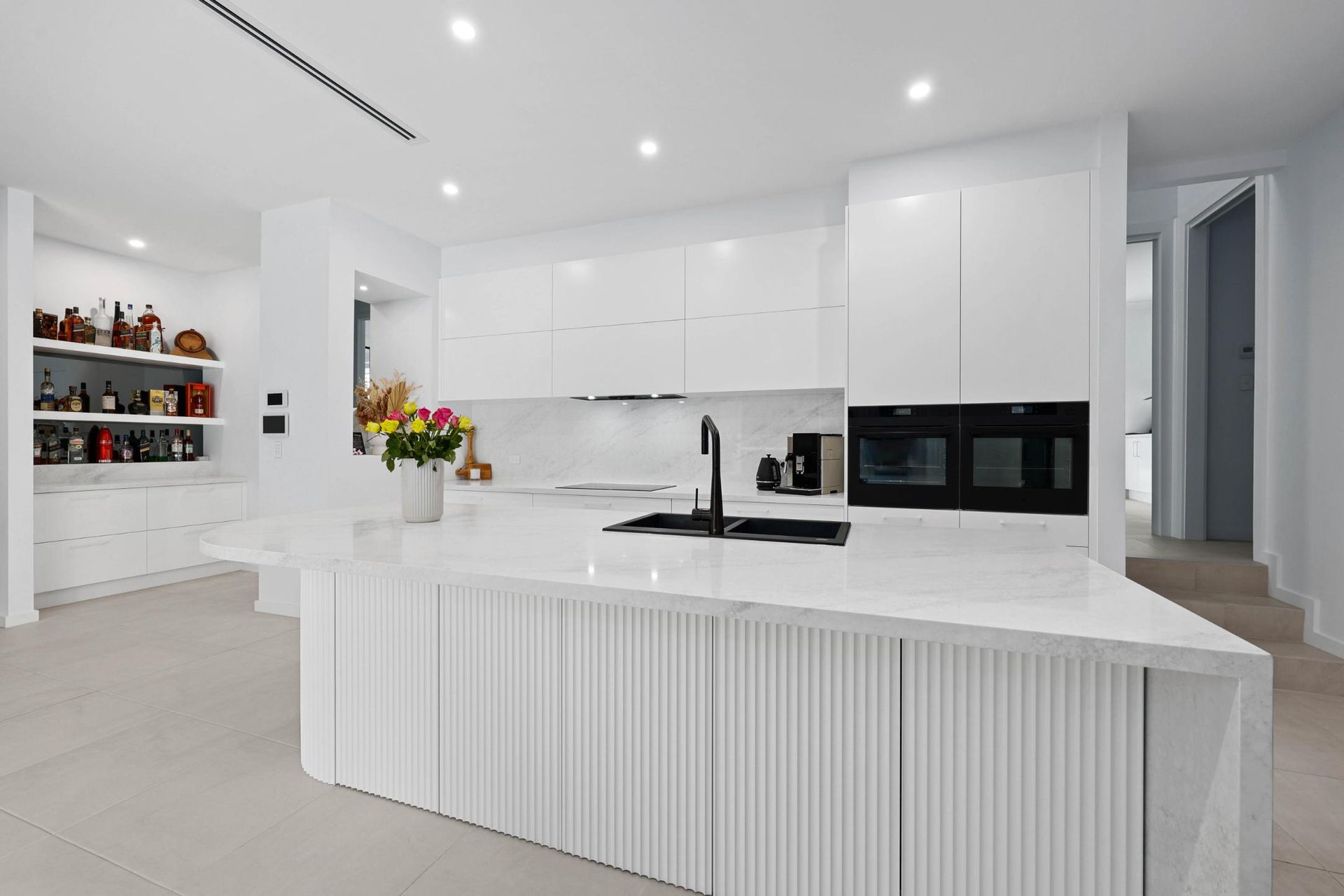 White Modern Kitchen with Island, Cabinets, and Built-In Ovens — Above & Beyond Interiors Custom Joinery in Currans Hill, NSW