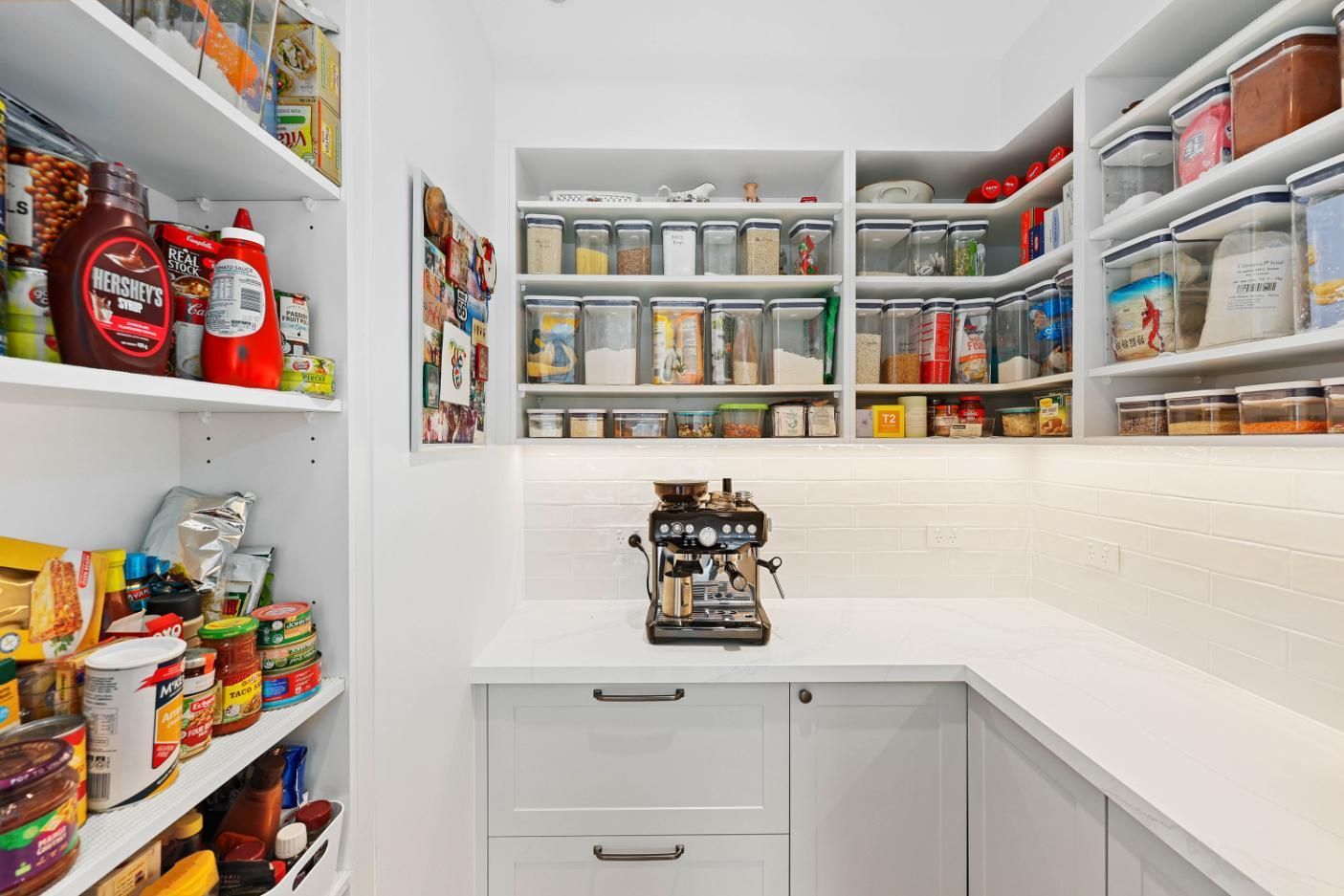 Well-Organized Pantry with White Shelves, Countertop, and Built-In Espresso Machine — Above & Beyond Interiors Custom Joinery in Yowie Bay, NSW