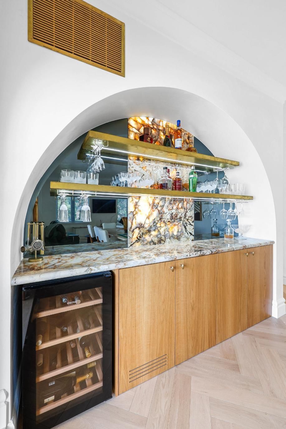 Built-In Home Bar with Wooden Cabinets, Wine Fridge, Arched Shelves, and Mirrored Backsplash — Above & Beyond Interiors Custom Joinery in Double Bay, NSW