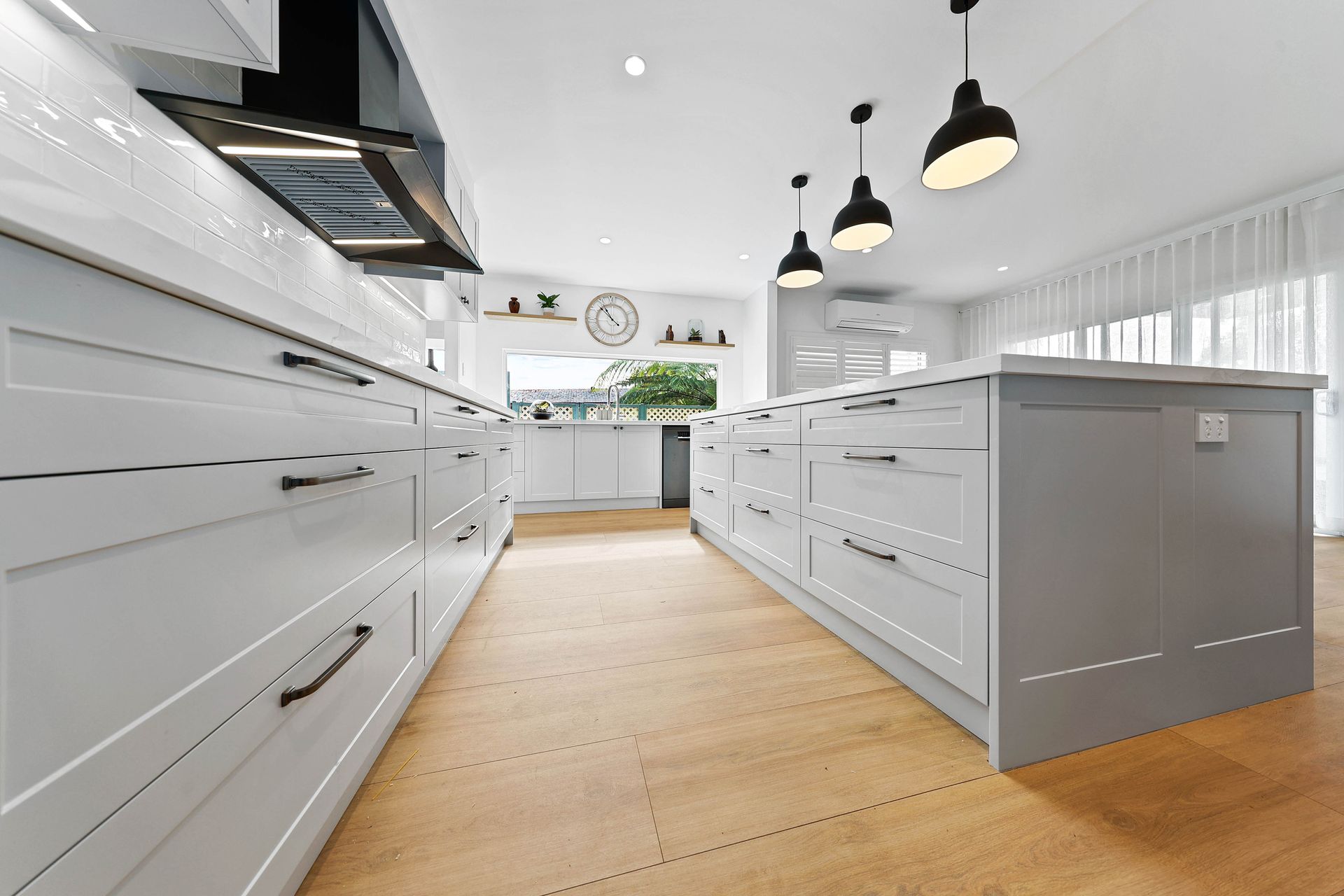 A Kitchen with Cabinets — Above & Beyond Interiors in Smeaton Grange, NSW