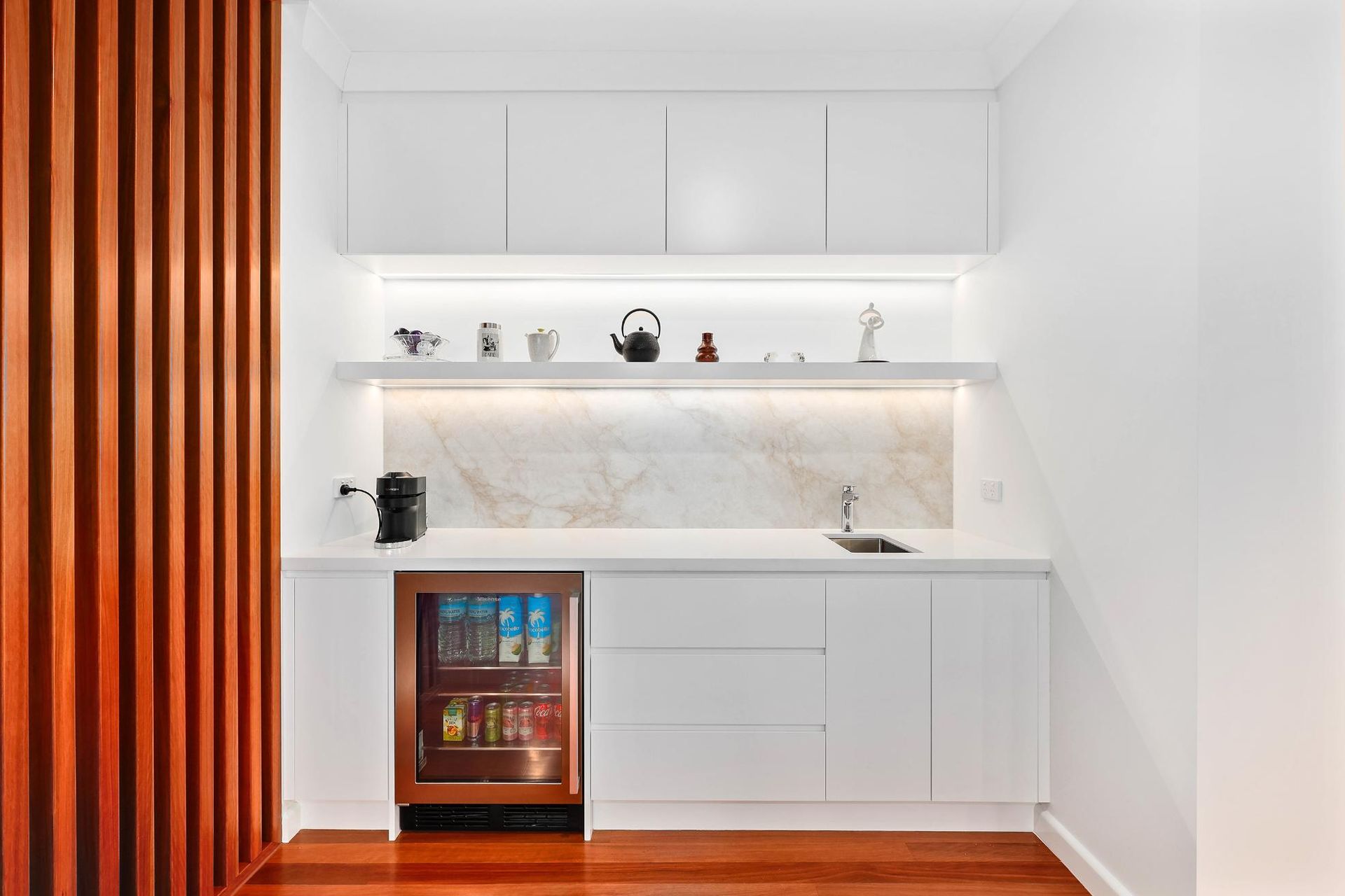 White Home Bar with A Mini-Fridge, Sink, and Wooden Accents — Above & Beyond Interiors Custom Joinery in Killara, NSW