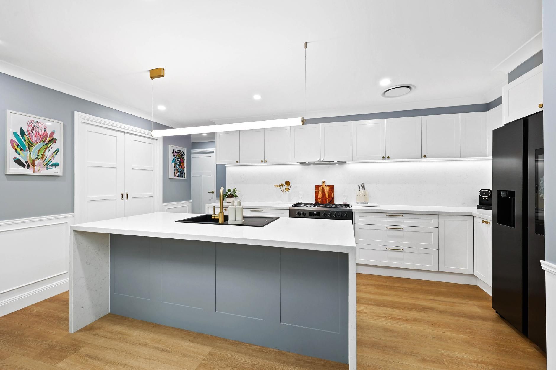 Modern Kitchen with White Cabinets, Grey Island, and Hardwood Floors — Above & Beyond Interiors Custom Joinery in Harrington Park, NSW