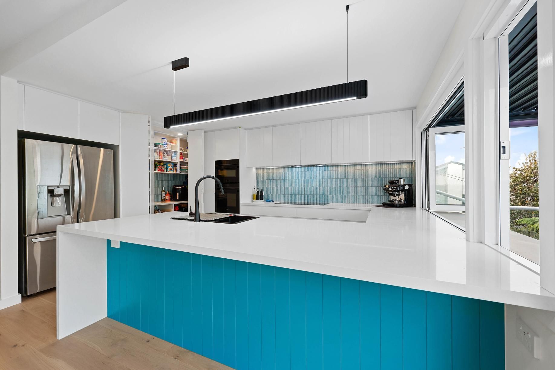 Modern Kitchen with White Cabinets, Teal Island, and Stainless Steel Appliances — Above & Beyond Interiors Custom Joinery in North Curl Curl, NSW