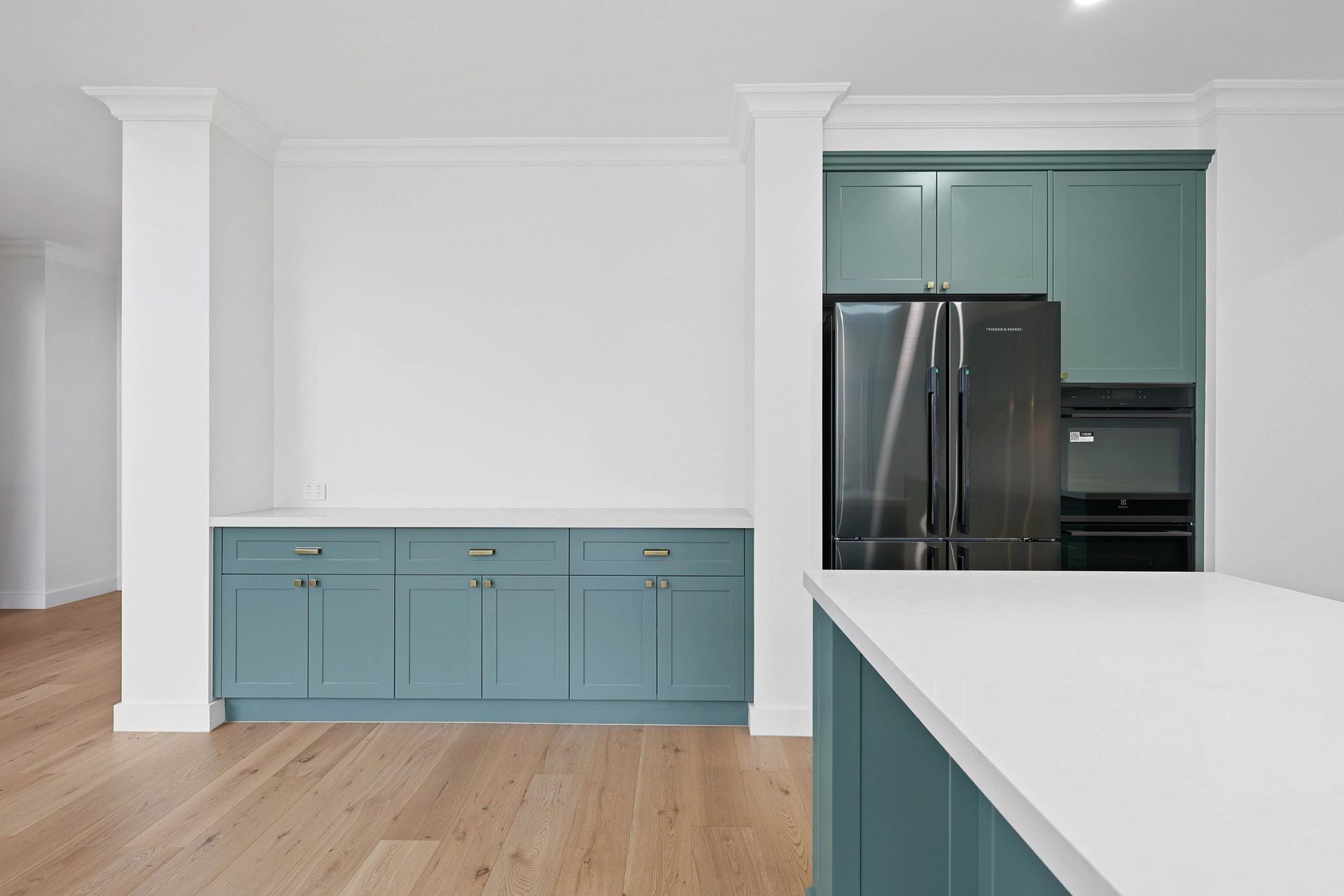 Modern Kitchen with Blue Cabinets, White Countertops, and Stainless Steel Appliances — Above & Beyond Interiors Custom Joinery in Appin, NSW