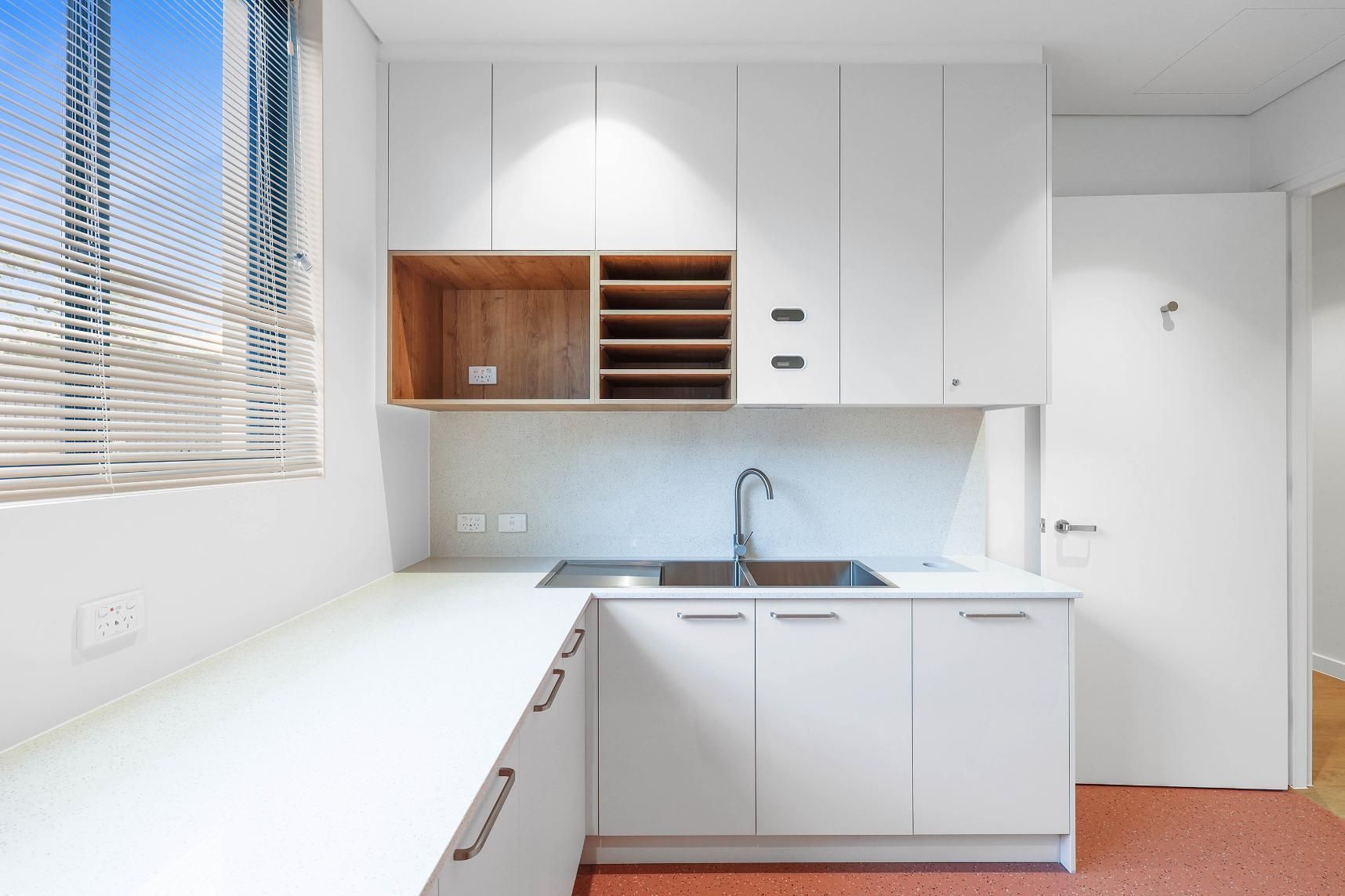 White Modern Laundry Room with Sink, Cabinets, and Window — Above & Beyond Interiors Custom Joinery in Medical Centre, NSW