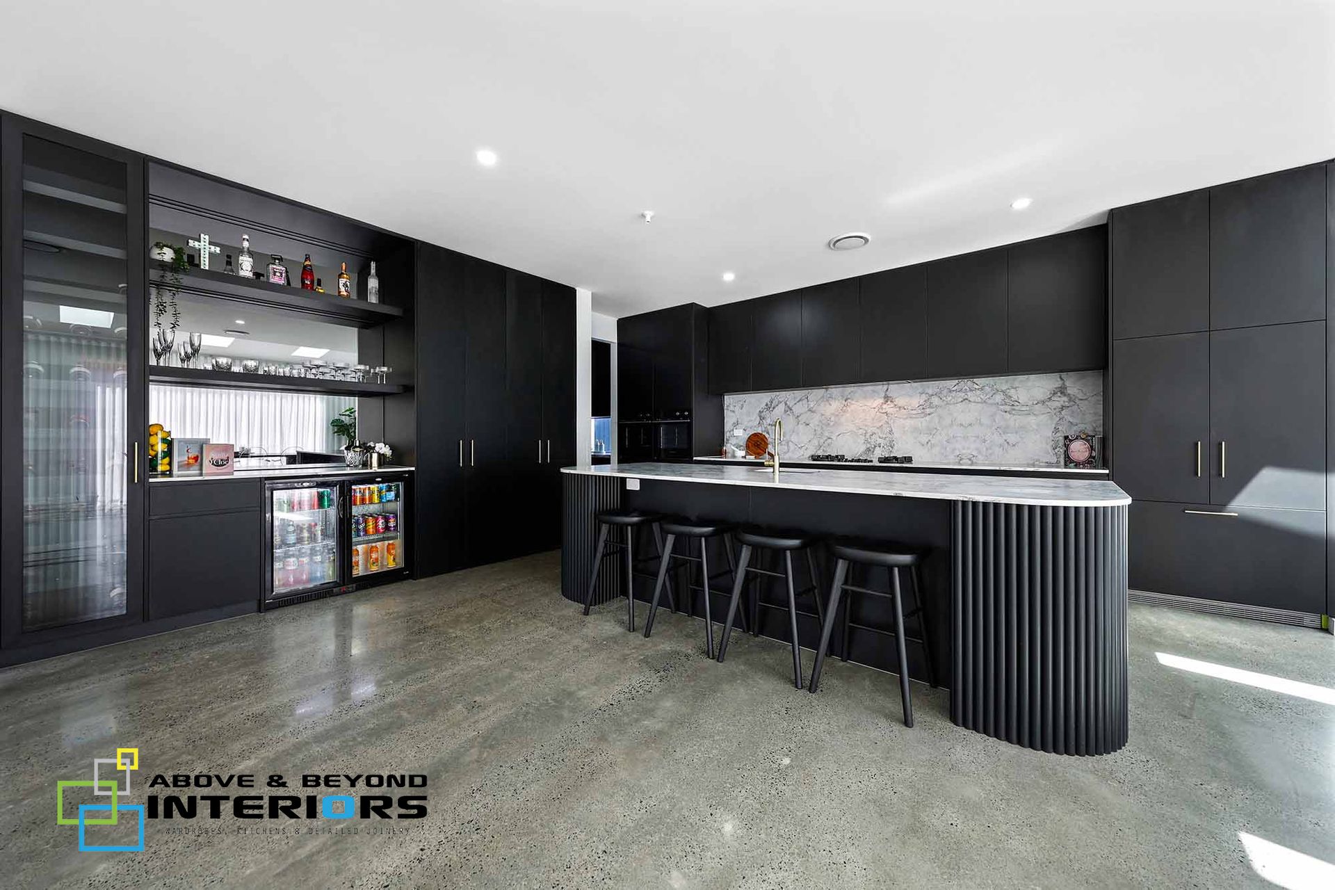 Modern Black Kitchen with Built-In Shelves, and Glossy Cabinetry, Viewed in A Bright Room — Above & Beyond Interiors in Smeaton Grange, NSW