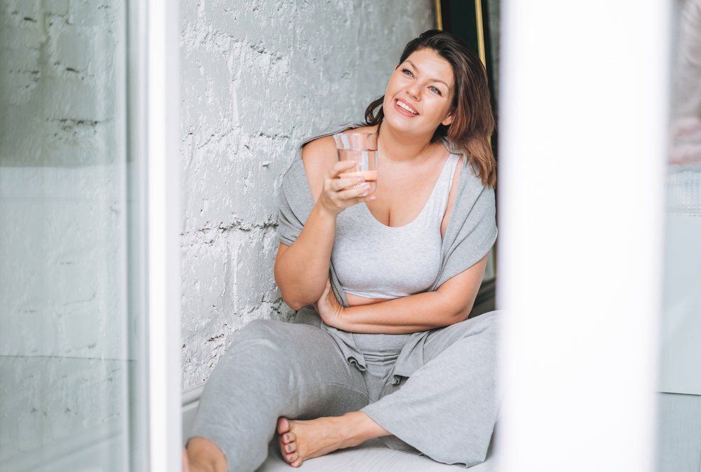 Happy Woman Relaxing — Colonic Healthcare in Rosslea, QLD