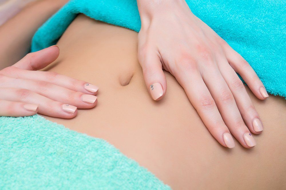 Colon Therapy Massaging Abdomen — Colonic Healthcare in Rosslea, QLD