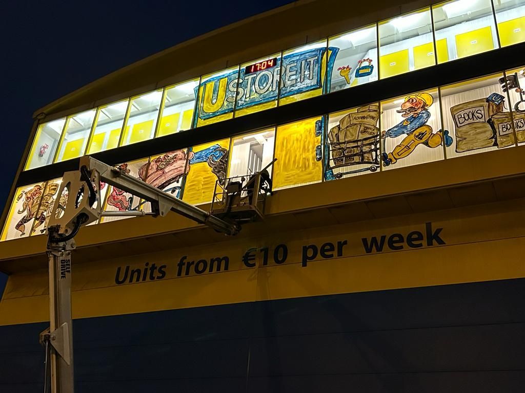 A building with a sign that says units from € 10 per week