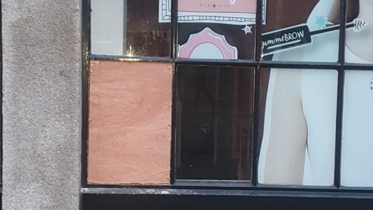 A window with a picture of a woman on it